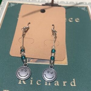 6x$15. Smiley Face Silver and Teal Earrings